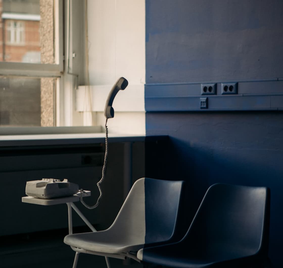 Predictive dialer in use — agent at desk with phone